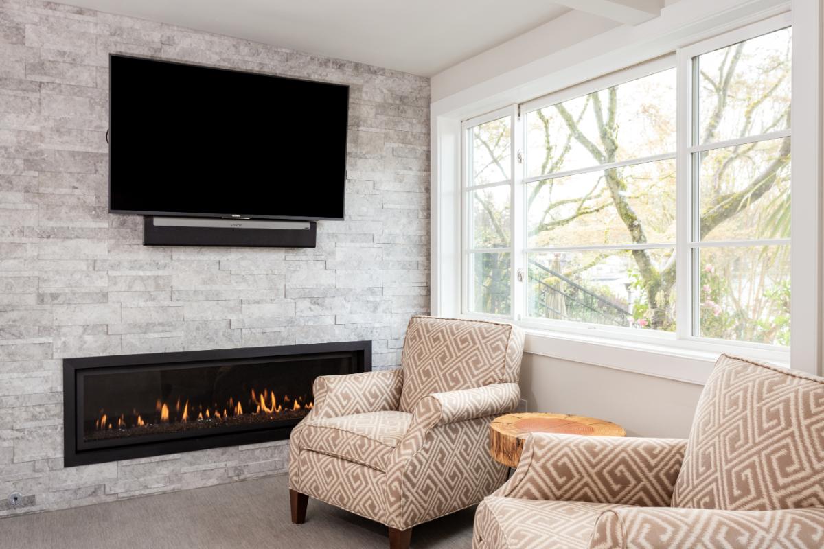 Luxury basement fireplace room to illustrate basement remodel contractors.