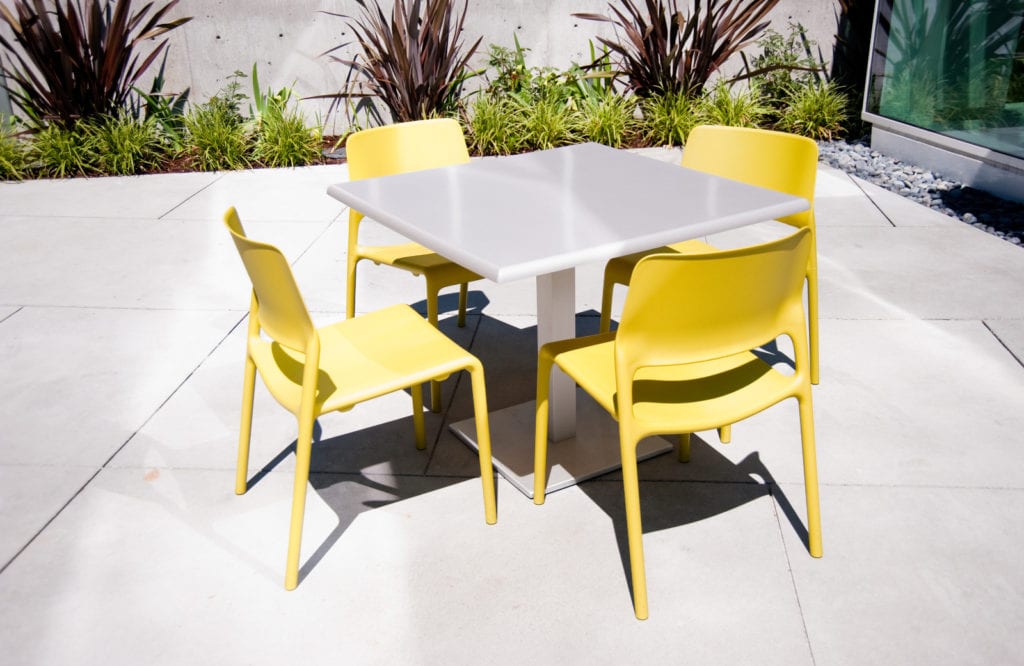 Yellow patio chairs and a table